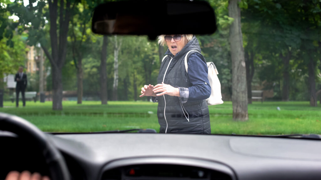 female-pedestrian-almost-being-hit-by-vehicle